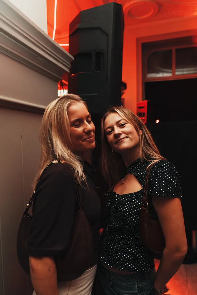 Two guests smiling for the camera