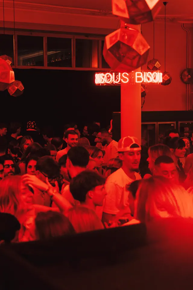 The dance floor and illuminated Bisous Bisous sign